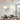 Byron Pendant Light in a bohemian kitchen — linen globe shade with rattan and natural wood accents