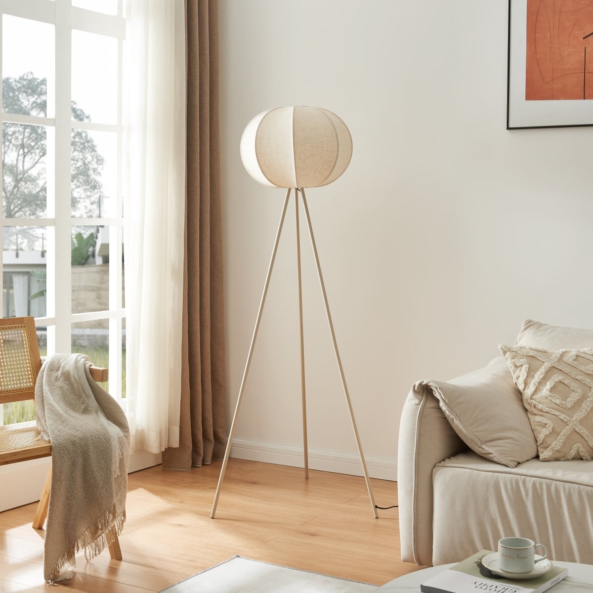 Corey tripod floor lamp in a bright living room
