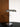 Halo I Table Lamp on a bedside table — built-in dimmer set to soft warm ambient reading light