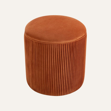 Quinn Ottoman pumpkin-shaped design, hero shot with warm accent lighting emphasizing its bold form.