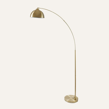 Venice Arc Floor Lamp in antique brass, showcasing its 79-inch arched design in a contemporary living room.