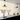 Flare Pendant Lamp in classic black, trumpet-shaped metal shade with white glass globe, studio view.