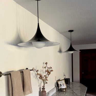 Flare Pendant Lamp in vibrant green, single fixture with adjustable cord against a white background.