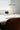 Halo I designer table lamp in a luxury bedroom — chrome finish with warm 3000K T30 bulb glow