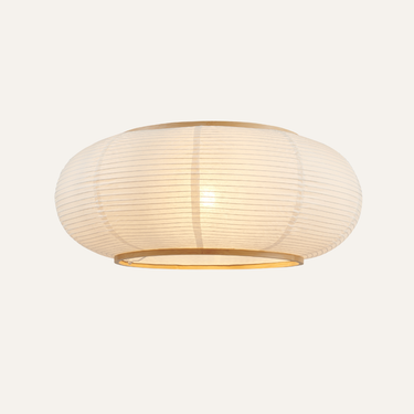 Lit Komorebi white paper flush mount ceiling light on a warm white background