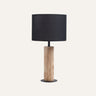 Lignis Table Lamp (white) styled in a boho bedroom — natural wood pairs with rattan and linen