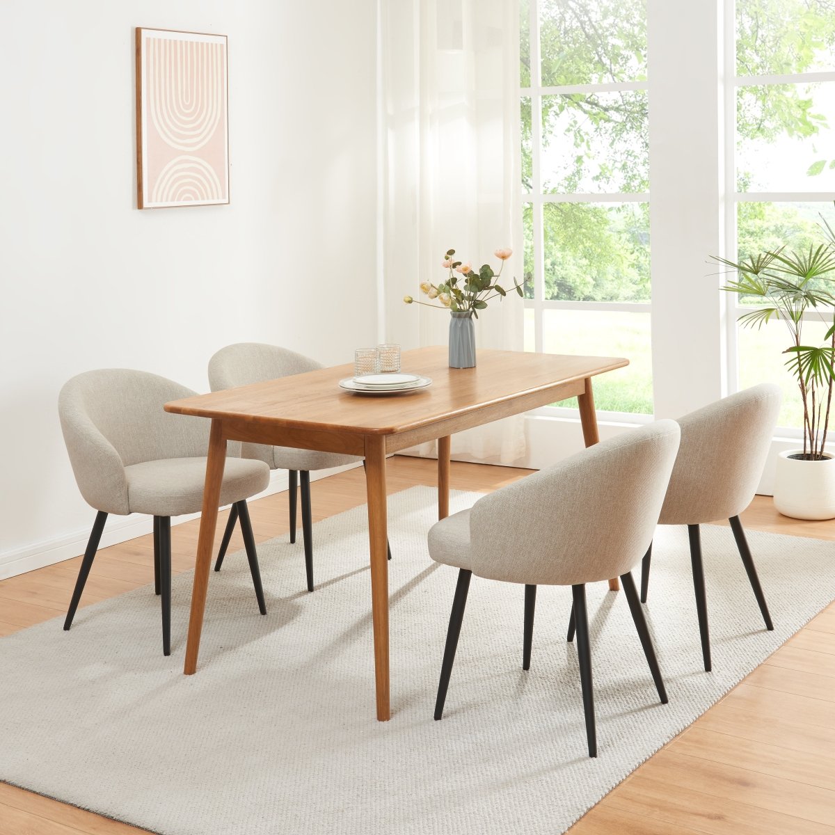Four Sand Sereni chairs styled around a natural wood dining table
