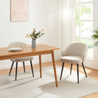 Sand chairs styled at a dining table. Table and accessories not included.
