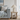 Alba white linen table lamp beside a pale blue sofa in a coastal living room