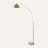 Venice Arc Floor Lamp in antique brass, showcasing its 79-inch arched design in a contemporary living room.