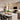 Willow Pendant Light black, pair of two pendants hanging symmetrically above a dining room table.