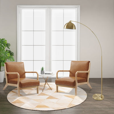 Two chairs and a standing floor lamp in a room with a large window