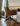 Riley Office Chair by Archiology, brown, with elegant design, placed next to a wooden desk in a minimalist interior.