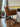 Riley Office Chair by Archiology, brown, with elegant design, placed next to a wooden desk in a minimalist interior.